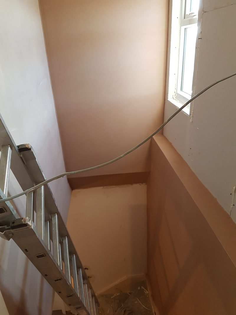 Stairwell walls fully skimmed – high-level access by CT2 Plastering & Rendering, Orpington