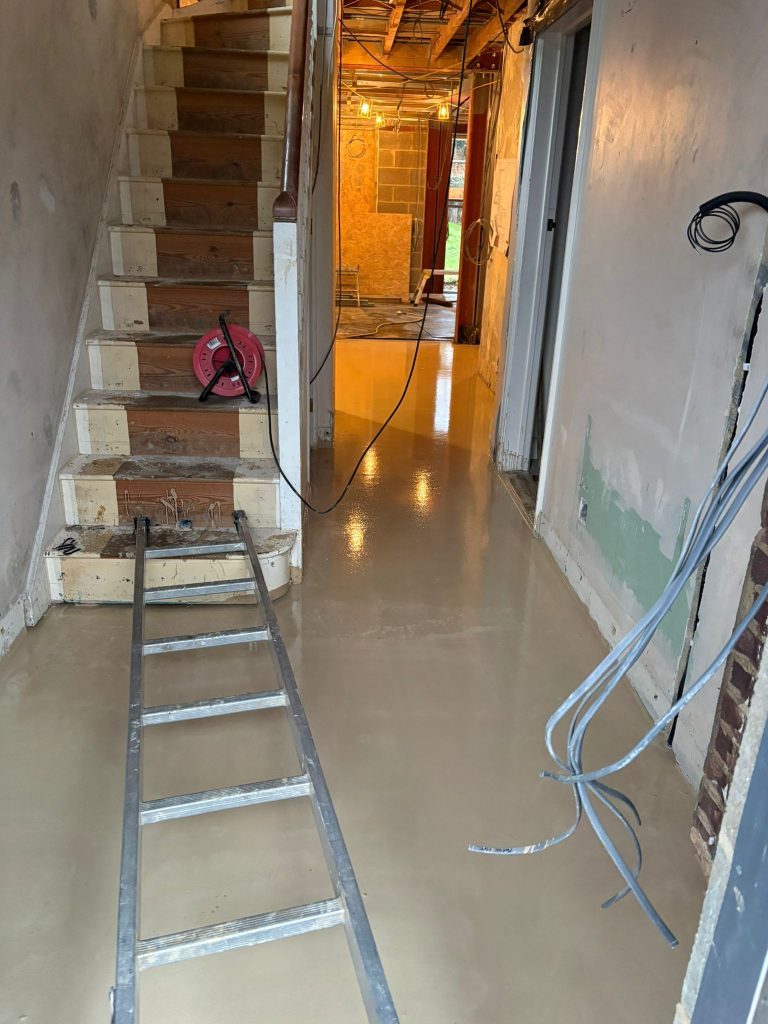 Self-levelling screed through hallway and kitchen by CT2 Plastering & Rendering, Orpington